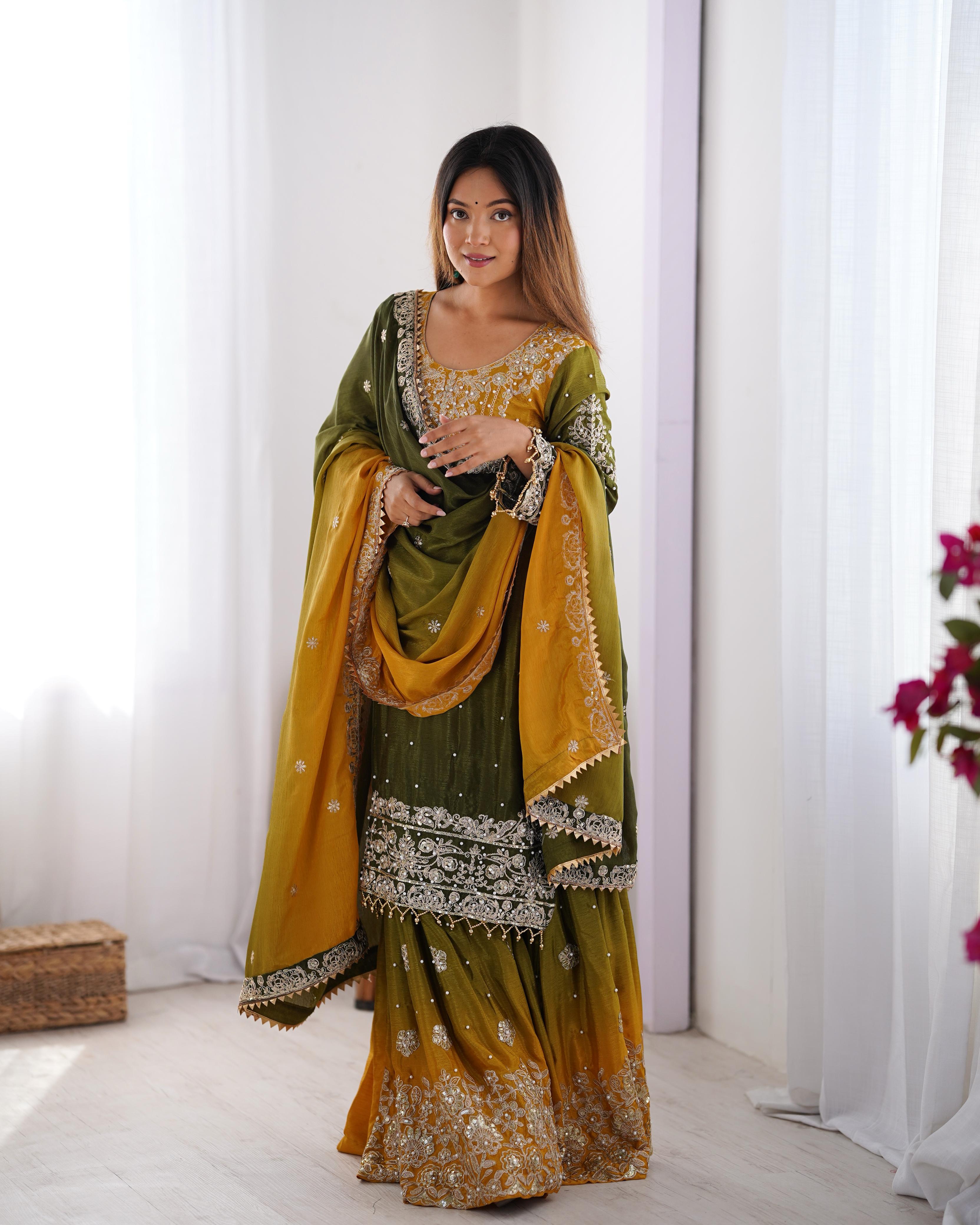 This Manvisha Yellow-Green Embroidered Sharara Suit Set is a luxurious choice for wedding wear, festive outfits, and partywear sharara suits. Crafted from premium Chinon silk, this designer sharara set features intricate cording dori embroidery, sequins work, and rivet moti detailing, making it an ideal pick for Indian wedding outfits. The fully stitched kurta boasts embroidery on both the front and back, complementing the stylish embroidered sharara pants with an elastic waistband for a comfortable fit. Pa